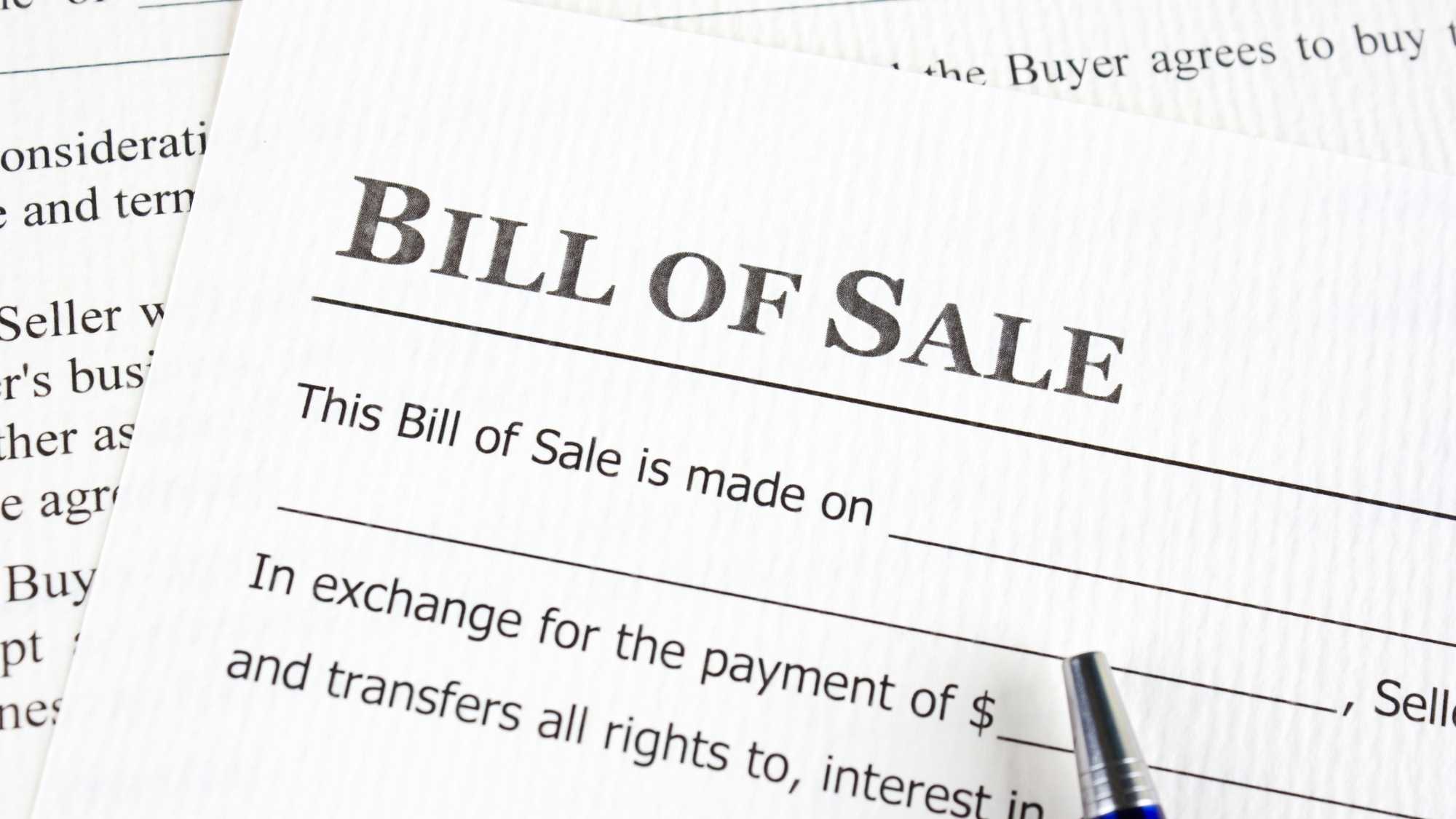 Bill of Sale con pluma en el papel.